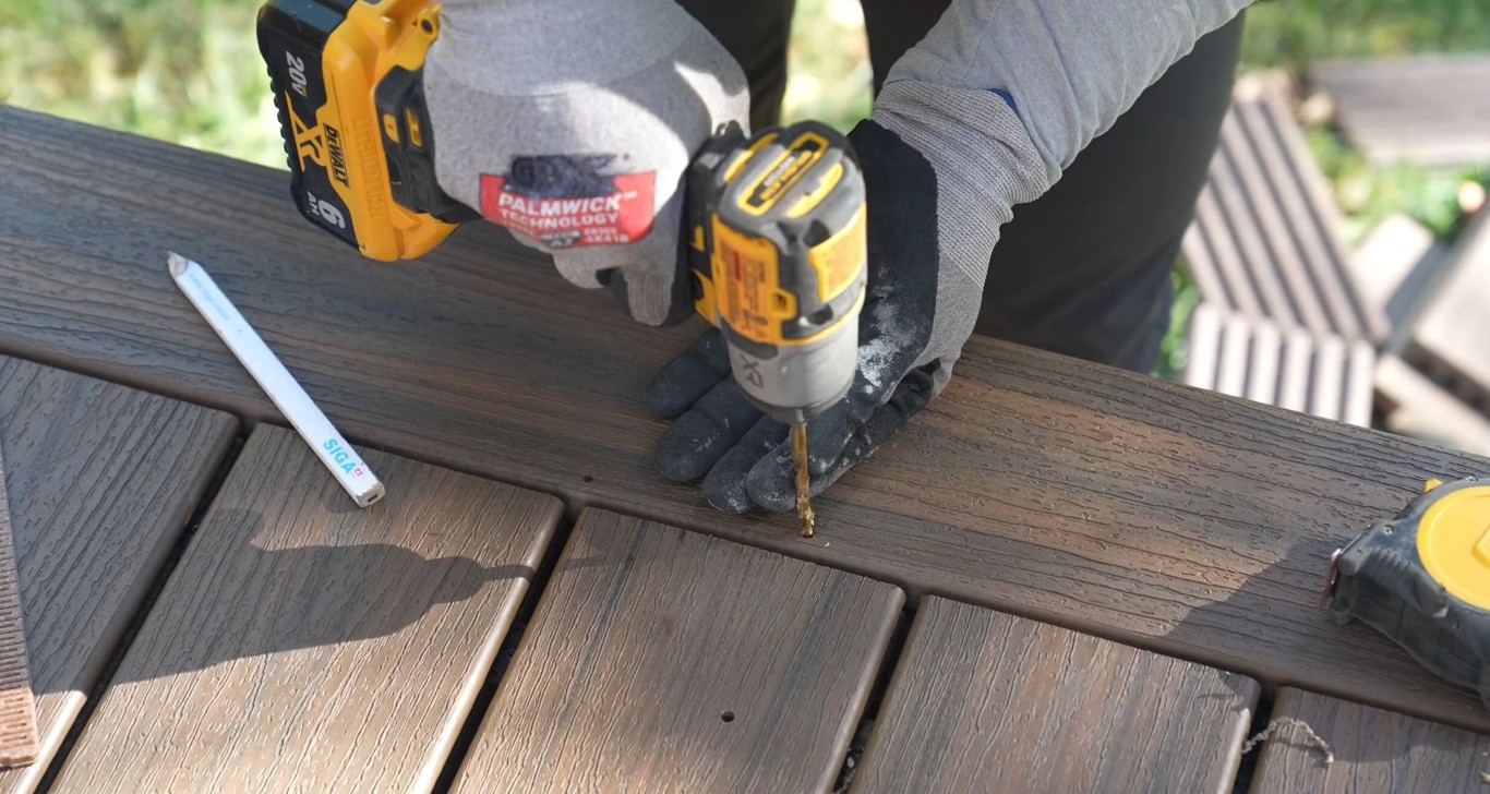 Professional deck builder installing composite decking in San Bernardino